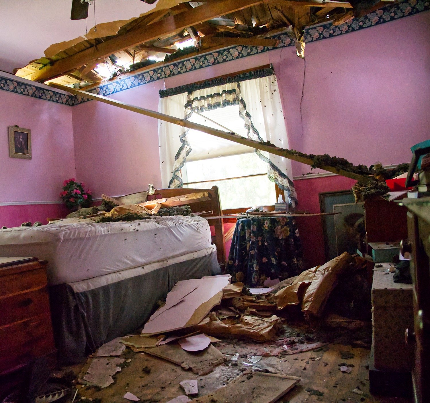 Christine Creswell is thankful she was not in her bedroom when a huge pine tree came crashing down on her Mineola home during Sunday evening’s thunderstorm.